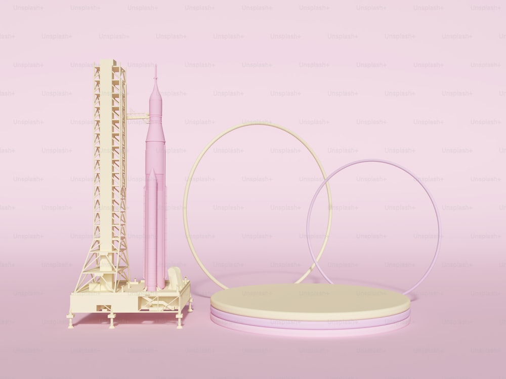 a pink and white model of a rocket and its stand