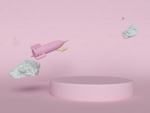 Ein rosa Objekt, das über ein rundes Objekt fliegt