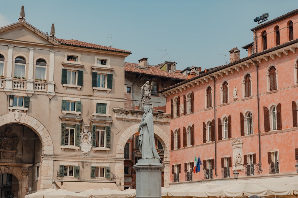 a statue in front of a building with many windows