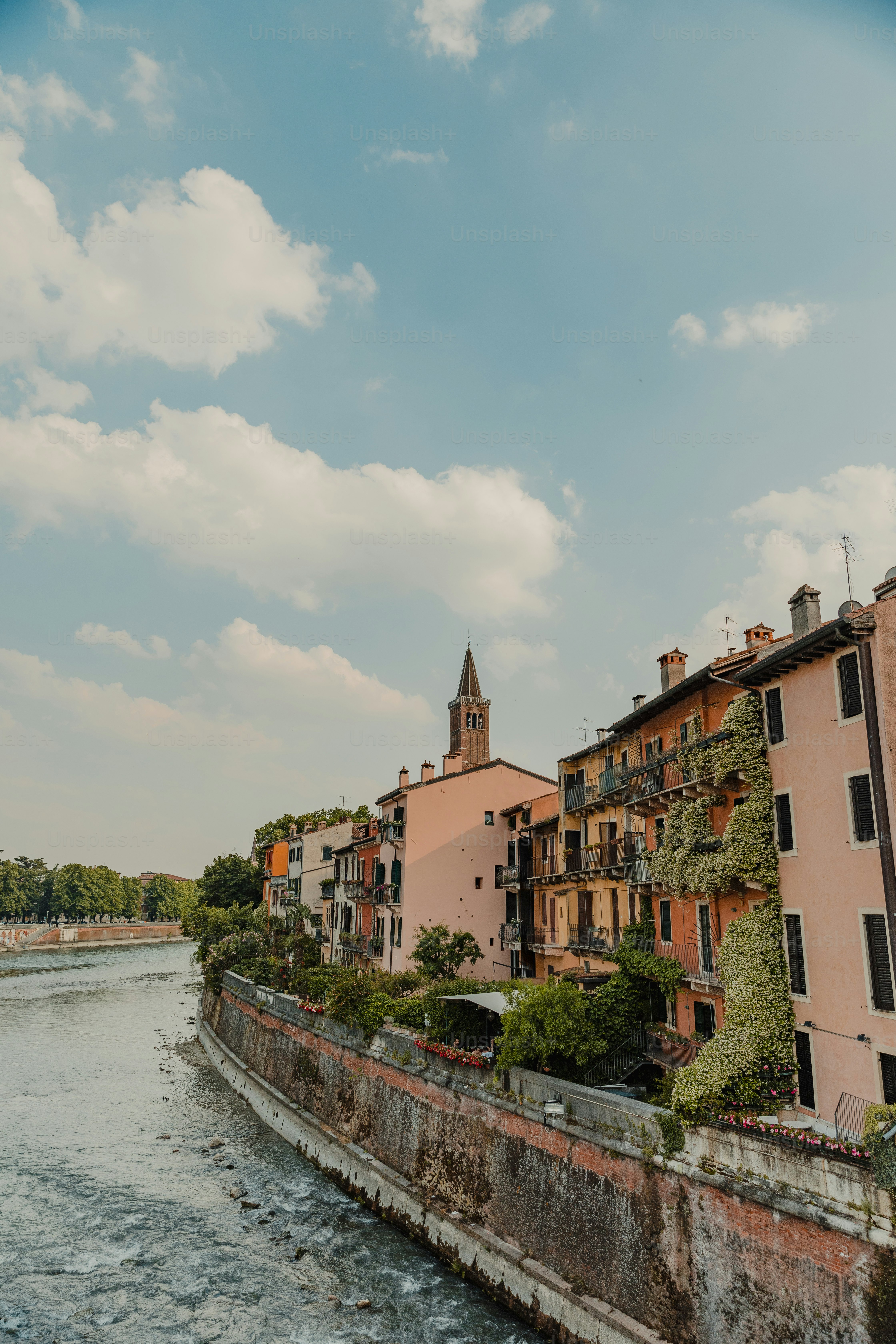 a river running through a city next to tall buildings