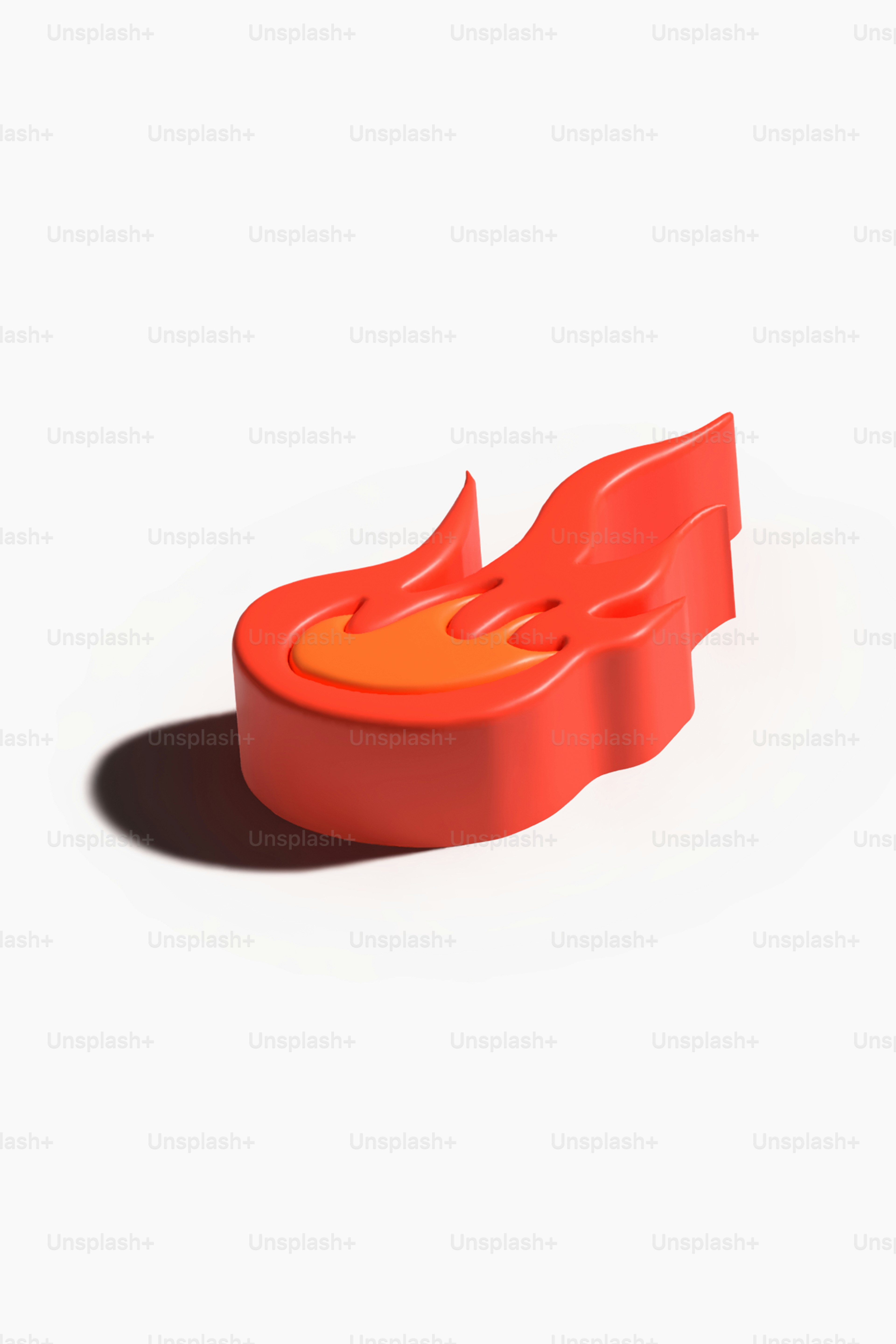 オレンジ色の物体が白い表面に横たわっている