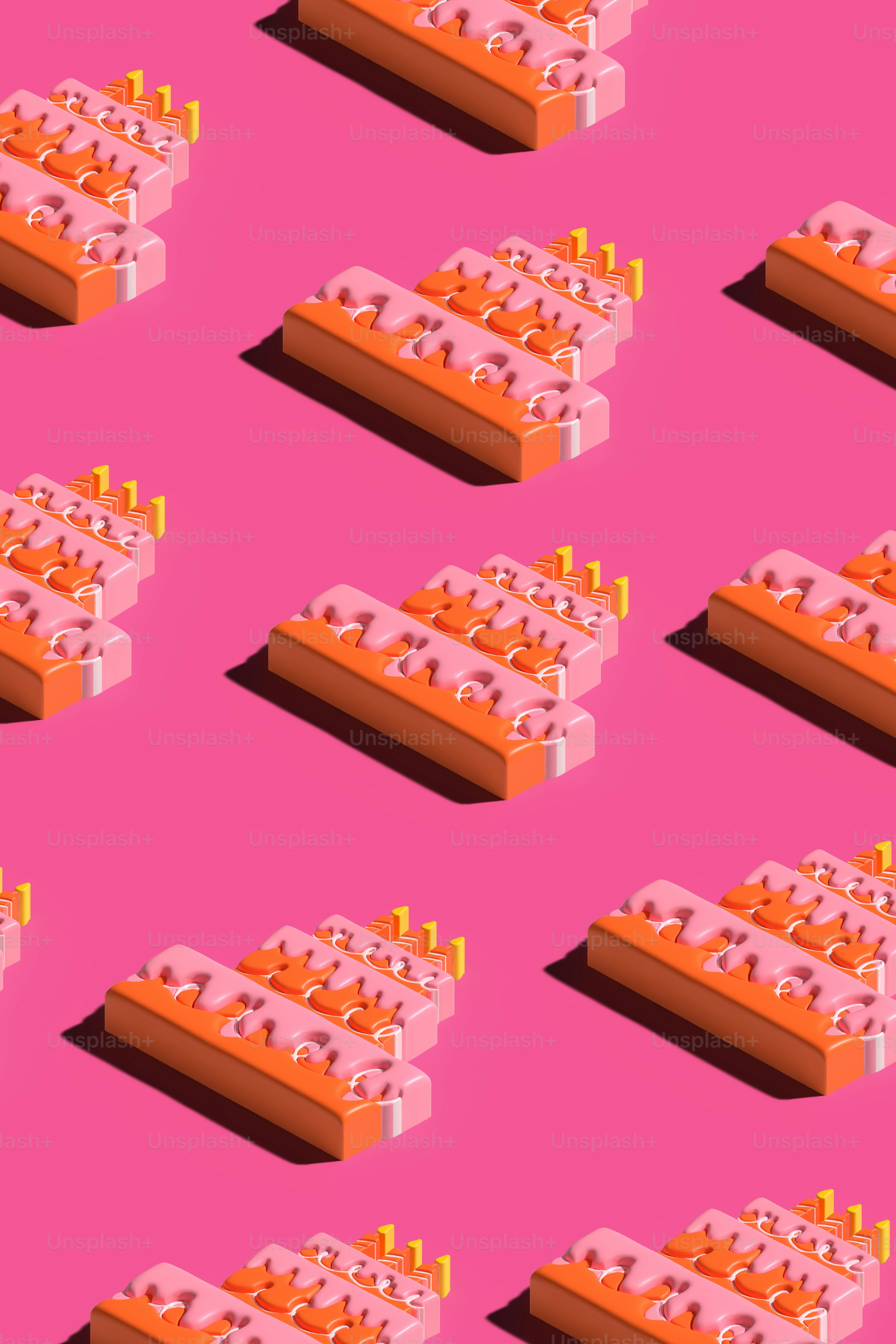 ピンクの背景にオレンジ色のオブジェクトがたくさん