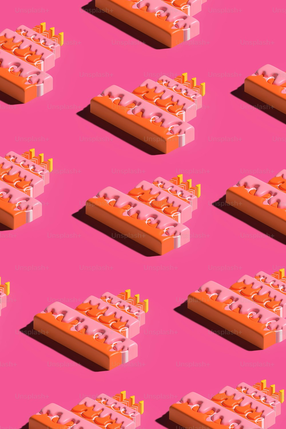 a pink background with a bunch of orange objects