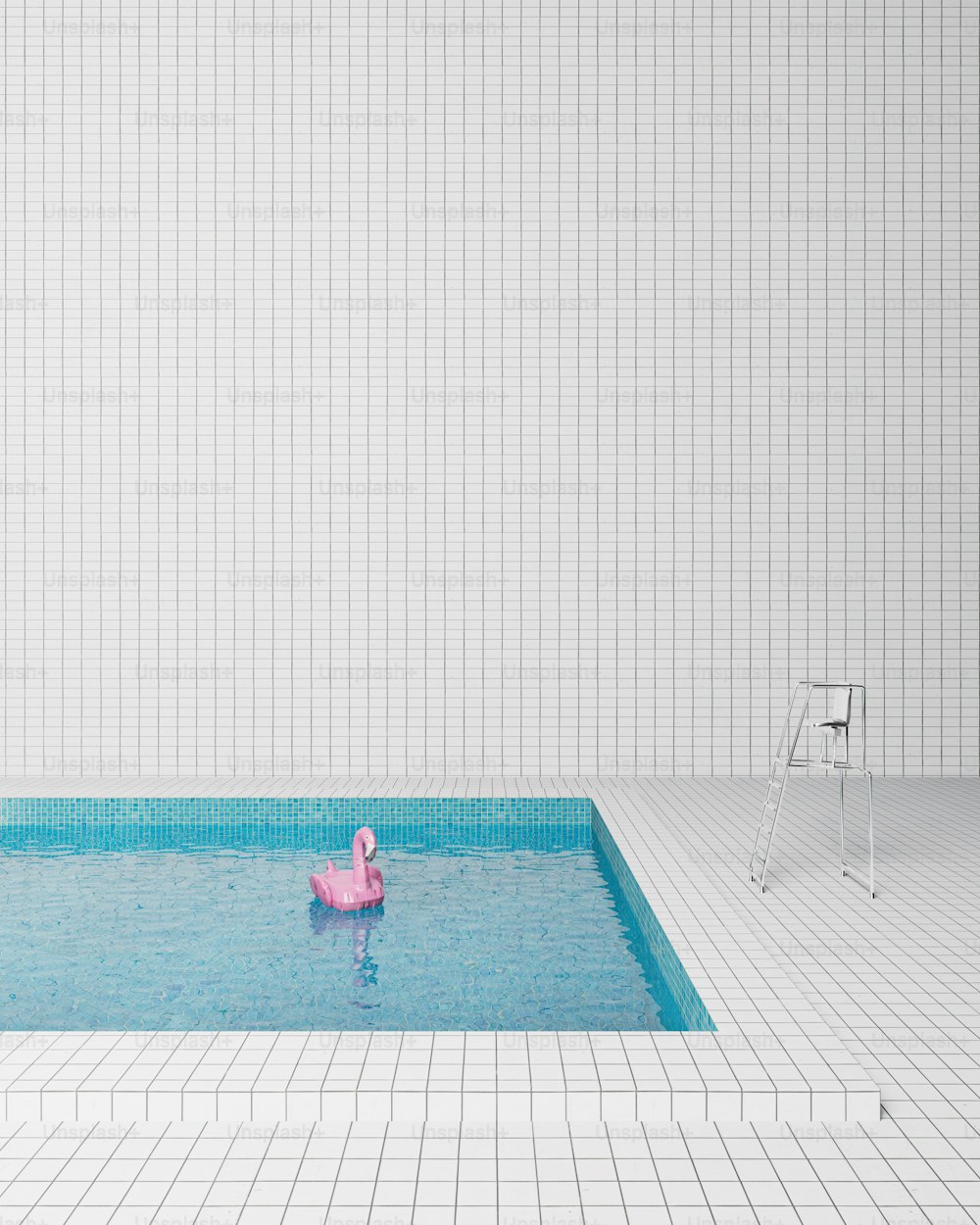 a pink flamingo floating in a pool of water