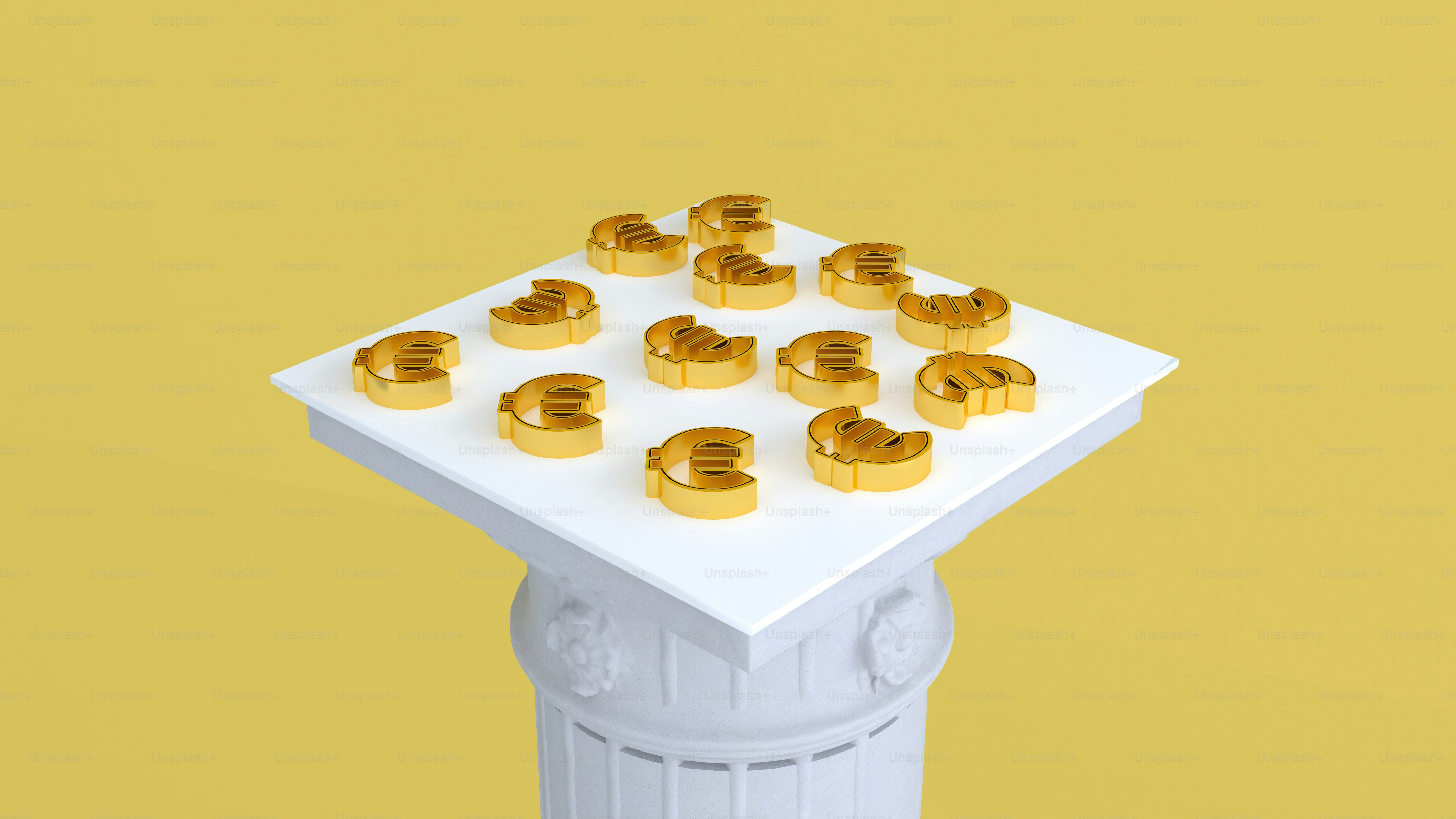 a bunch of gold objects sitting on top of a white table