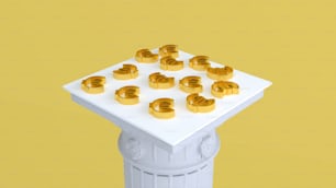 a bunch of gold objects sitting on top of a white table