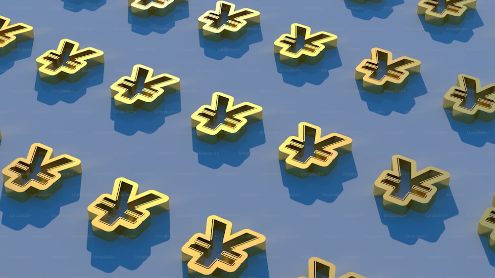 a bunch of gold letters that are on a blue surface