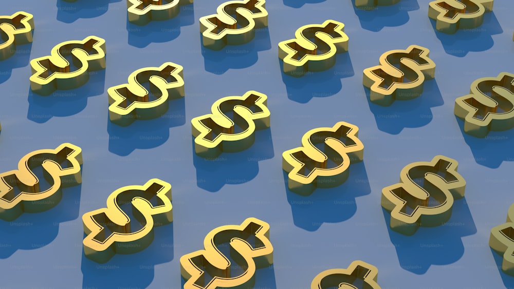 a group of gold dollar signs sitting on top of a blue surface