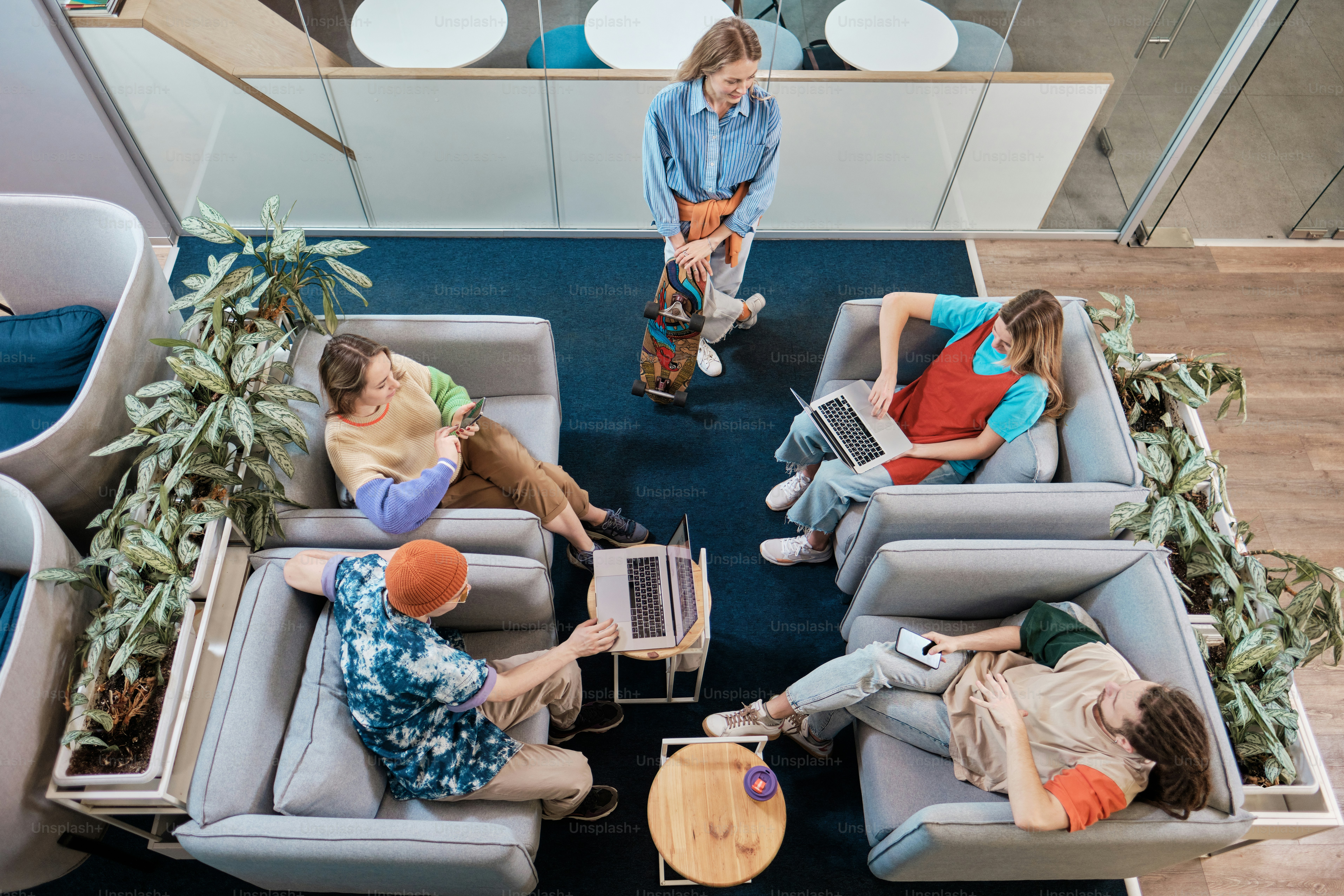 a group of people sitting on couches in a room