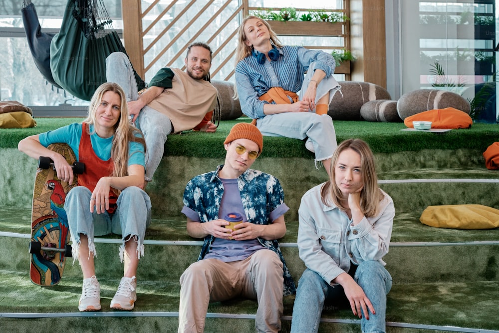 a group of people sitting on a set of stairs