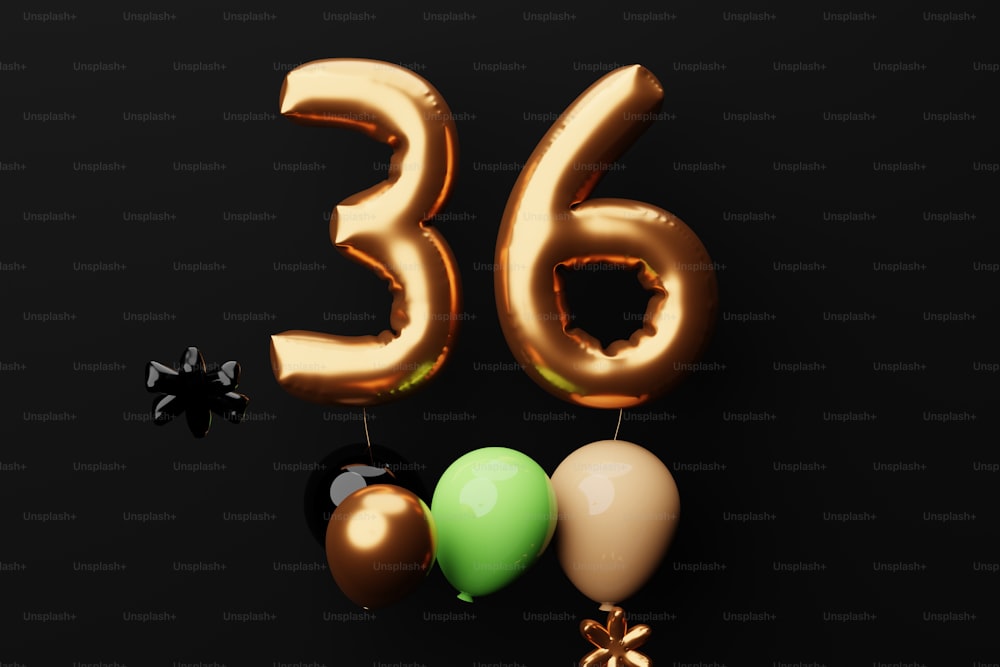 a number of balloons and a bow on a black background