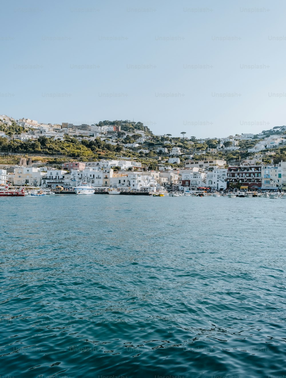 a body of water with a city in the background