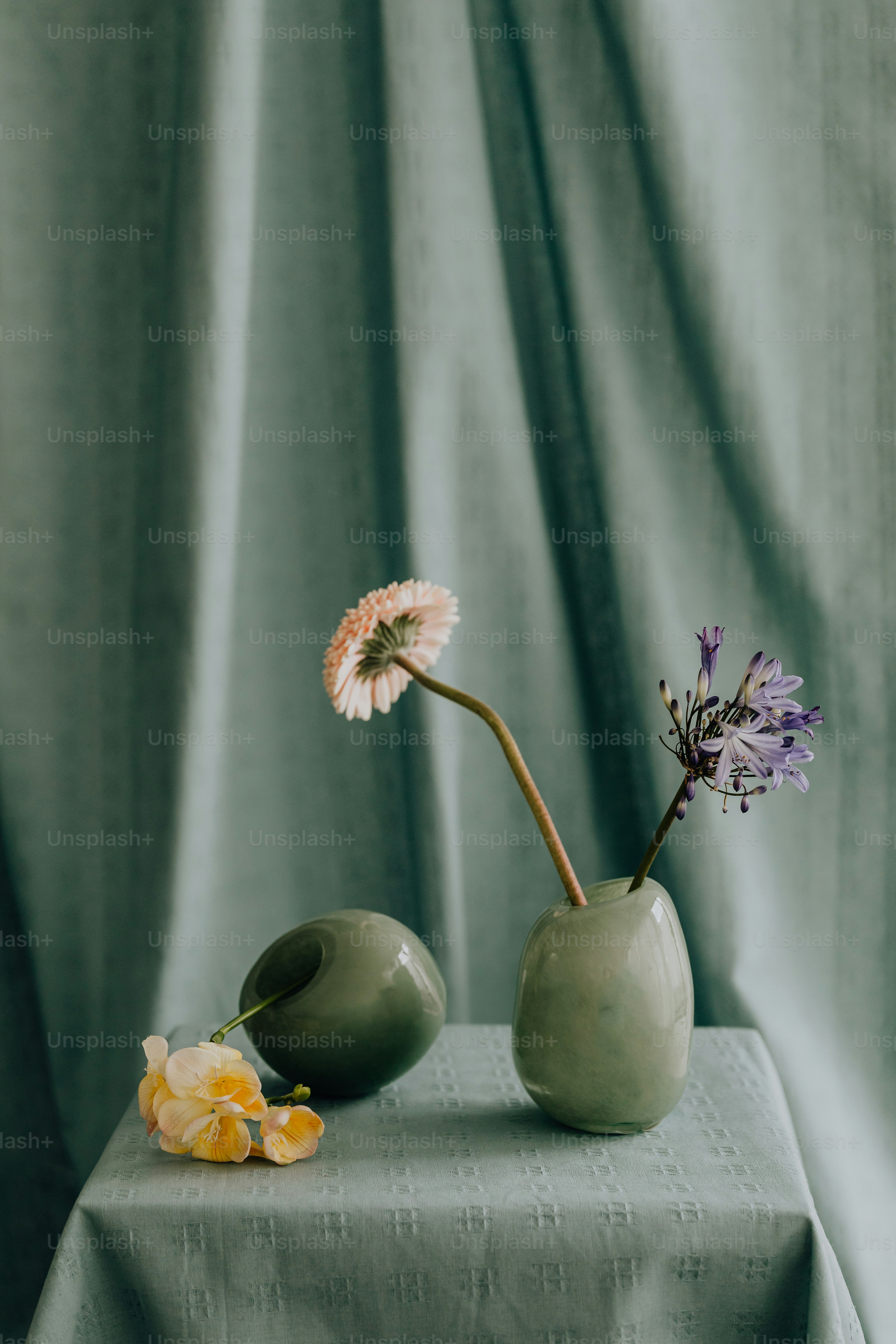 a couple of vases sitting on top of a table