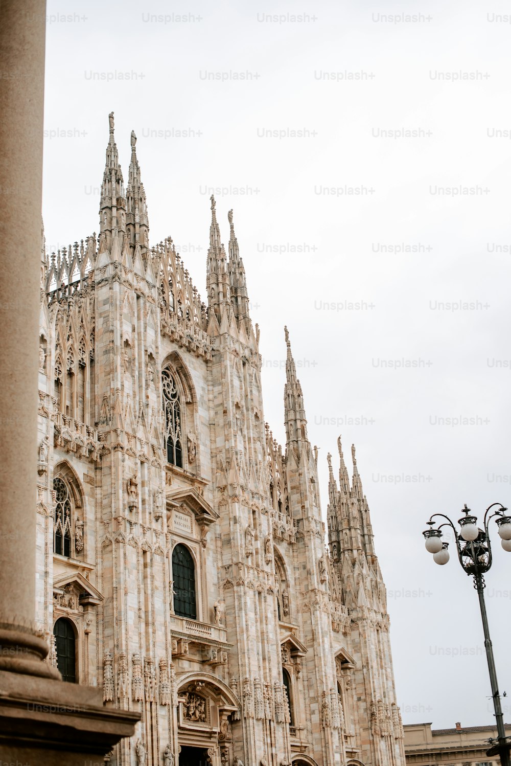 a tall cathedral with a clock on the front of it