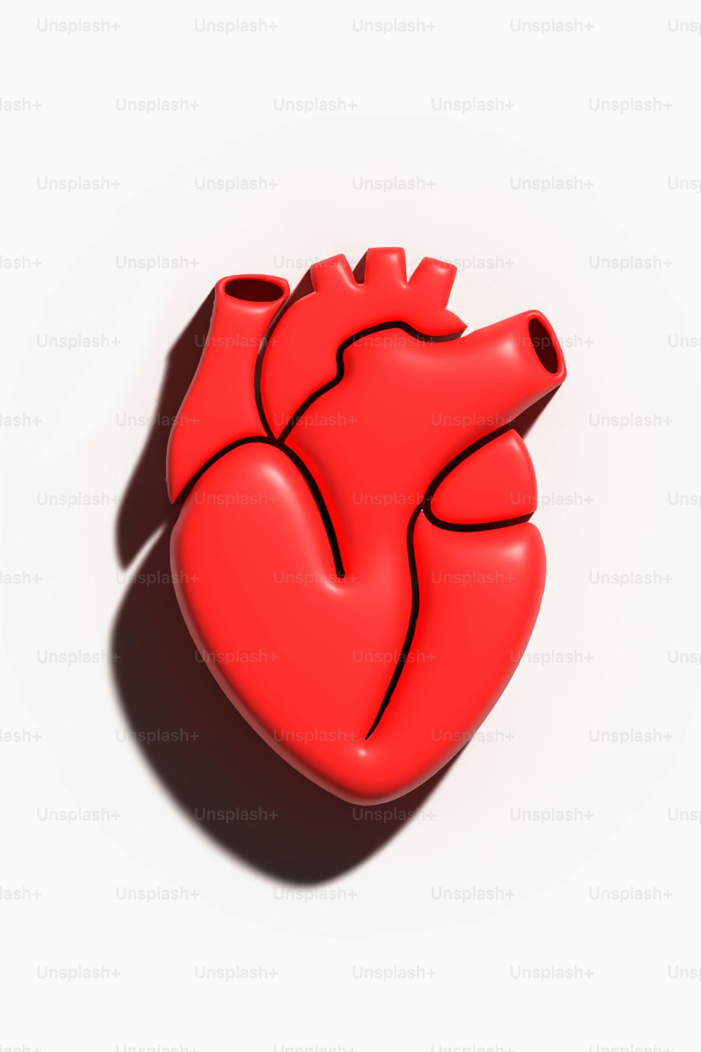 a red heart shaped object on a white background