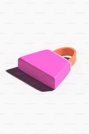 a pink and orange box sitting on top of a white surface
