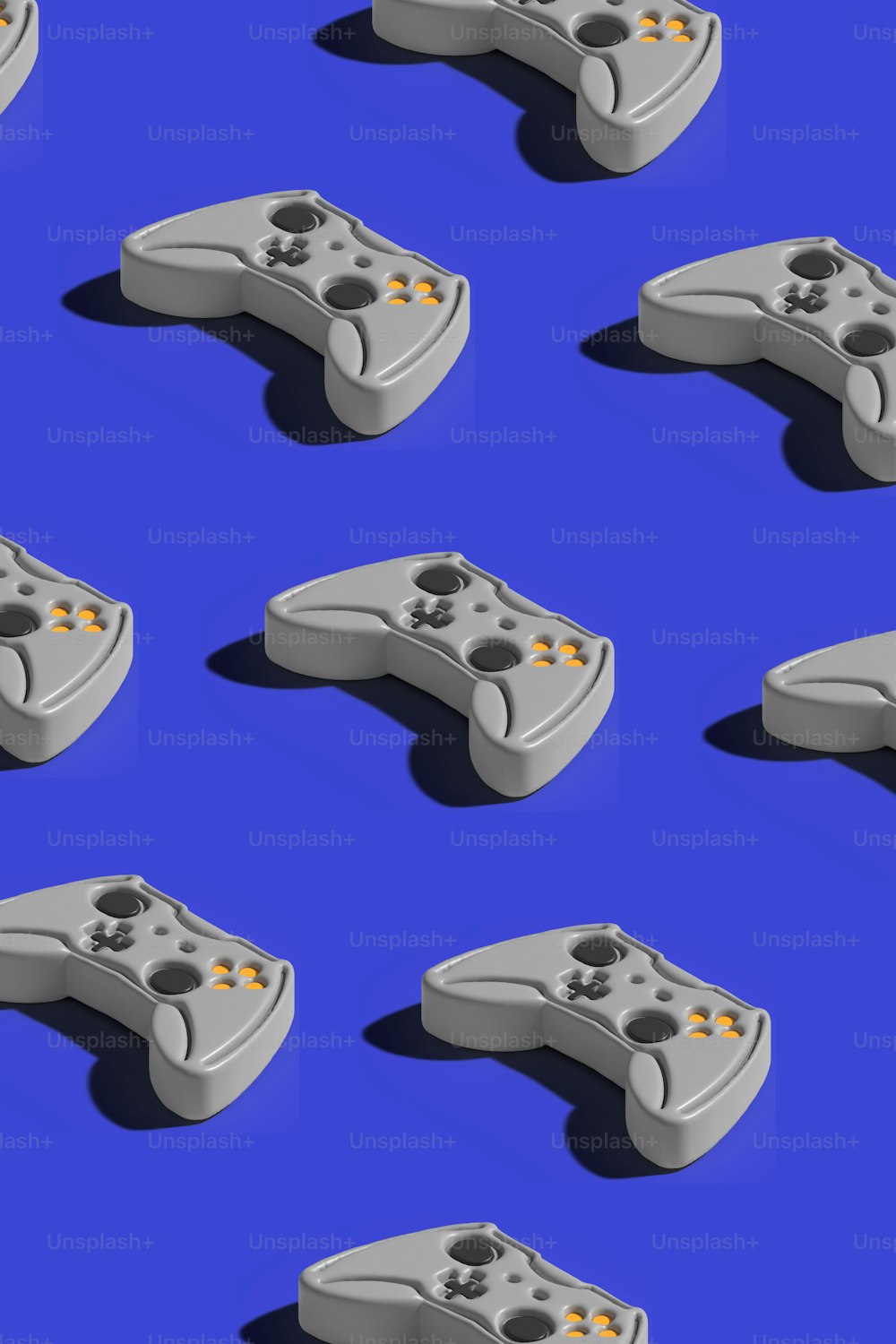 um monte de controladores de videogame em um fundo azul