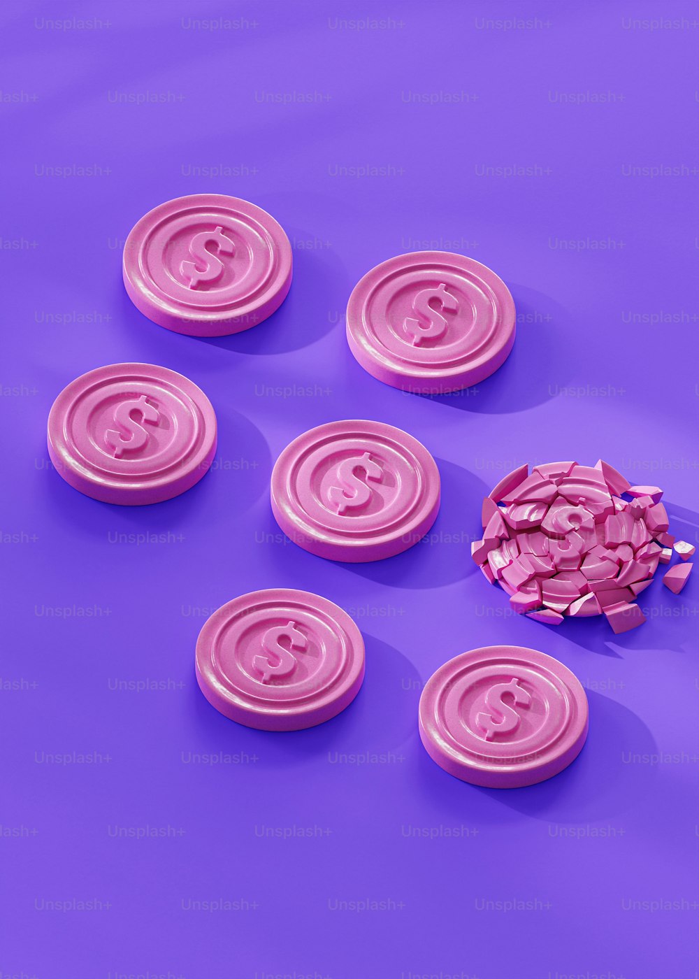 Un gruppo di bottoni rosa seduti sopra una superficie viola