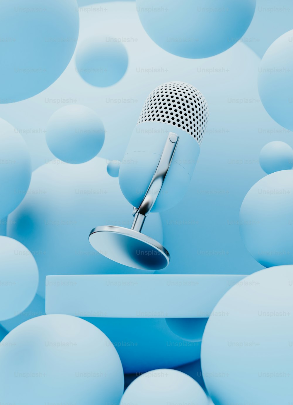 a microphone sitting on top of a table surrounded by blue balls