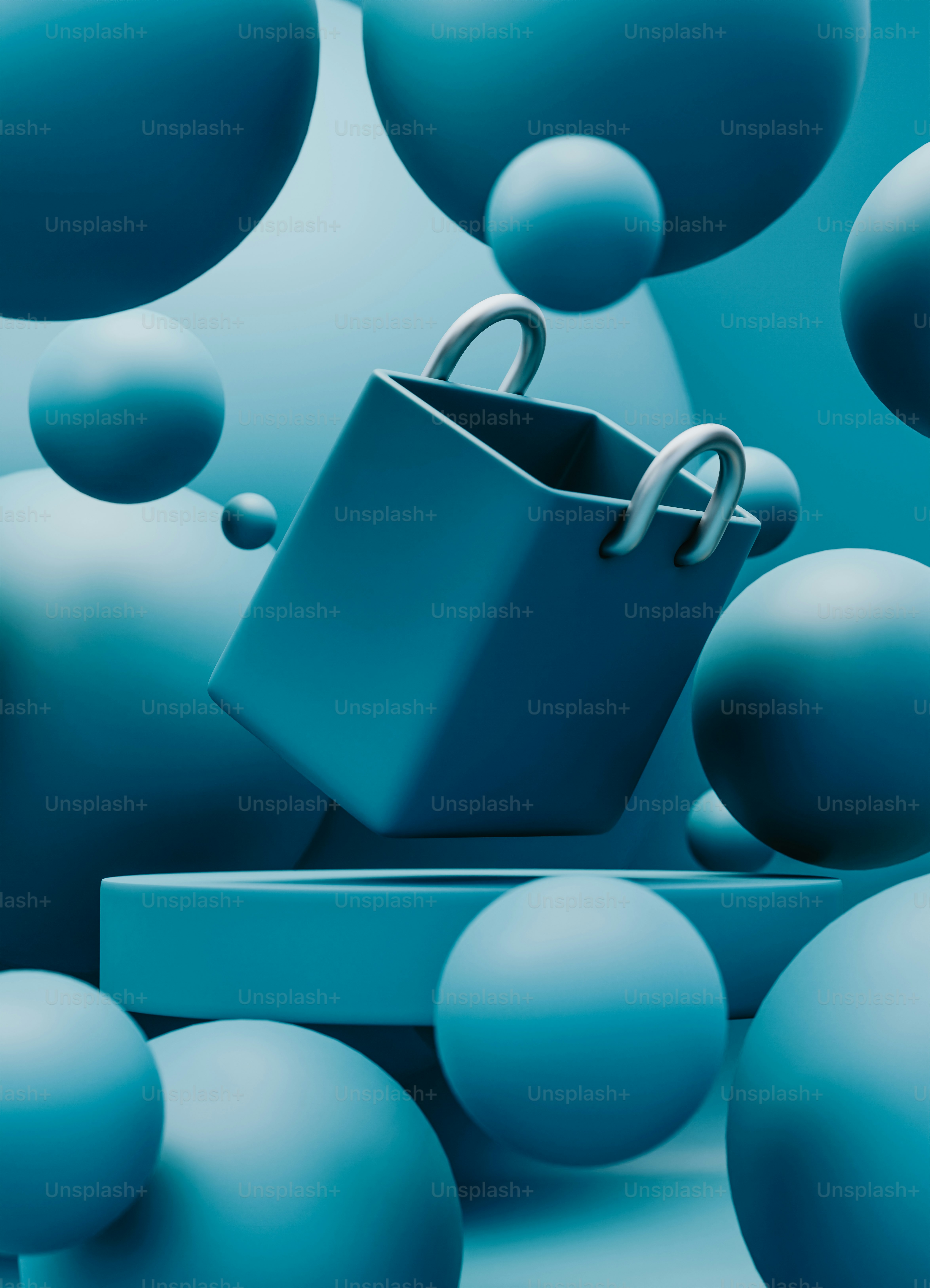 A blue box with a handle surrounded by blue balls photo – Image on Unsplash