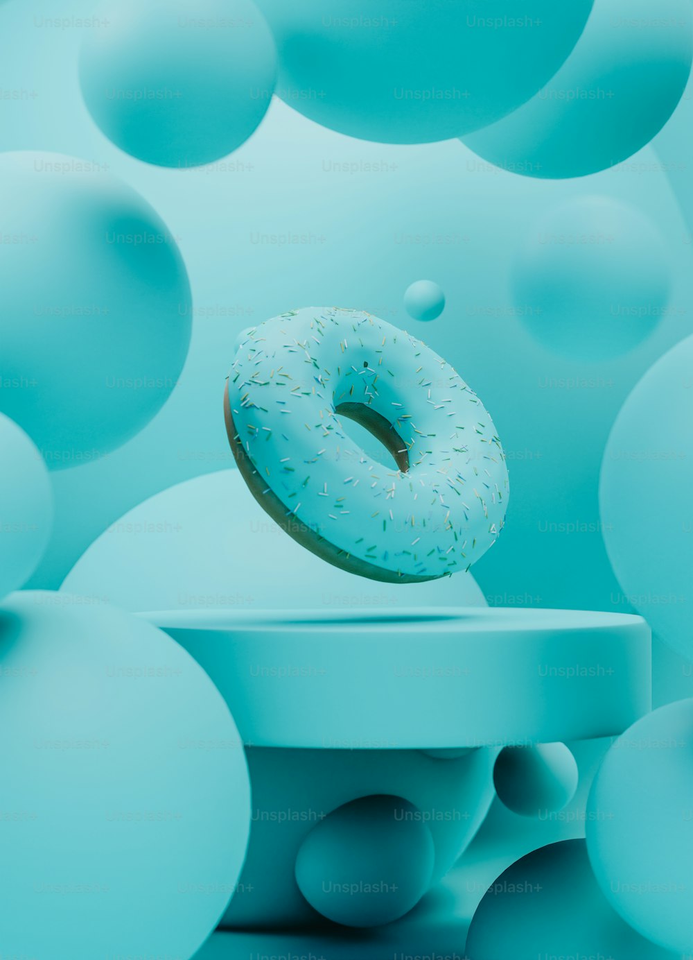 um donut sentado em cima de uma mesa cercado por bolas azuis