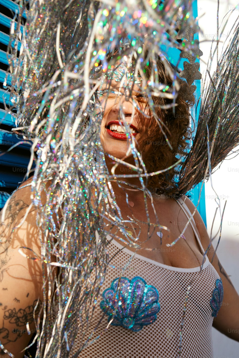 a woman with a bunch of tinsel on her head
