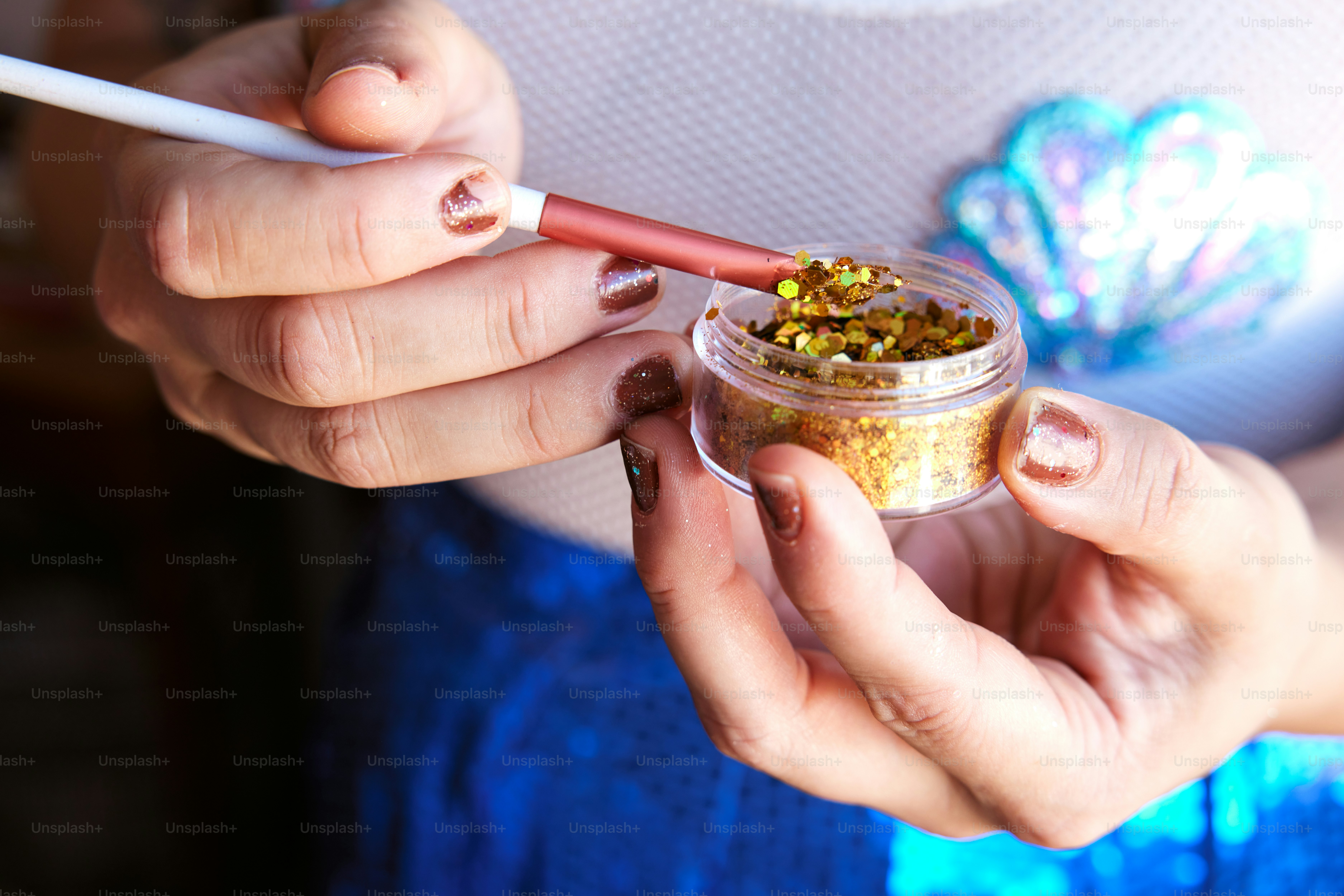a woman holding a cup of food and a cigarette