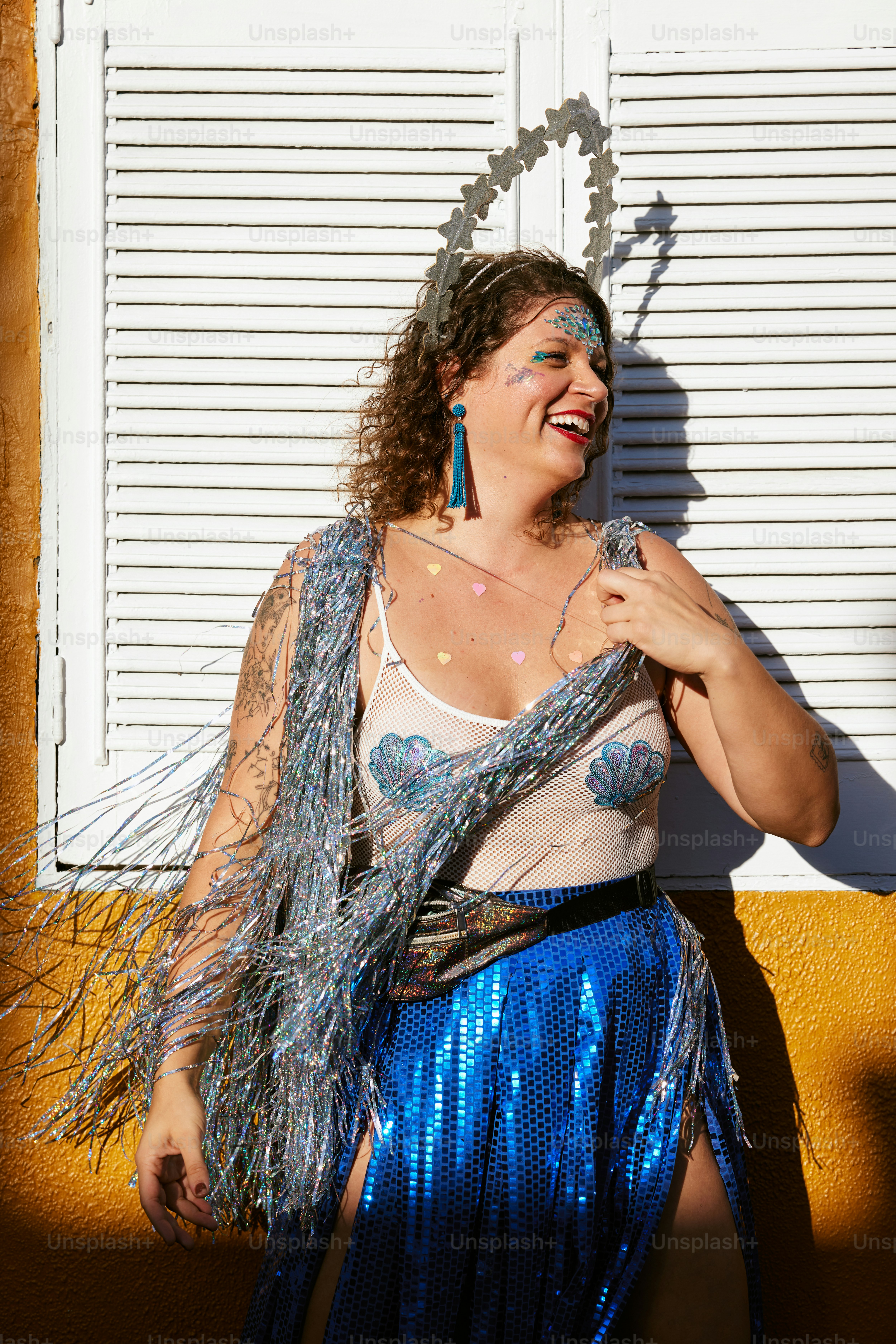 a woman in a blue skirt is smiling