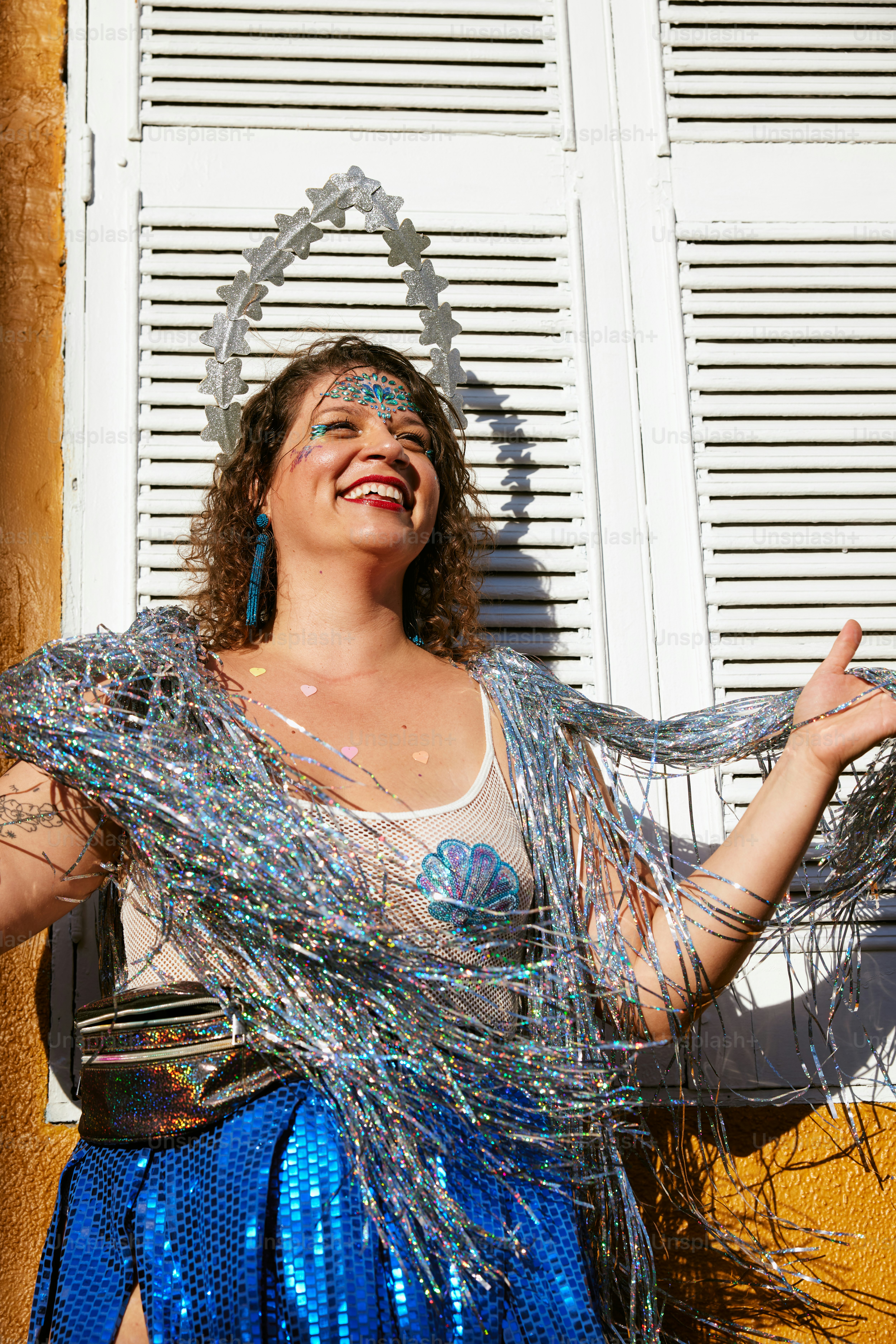 a woman in a blue skirt and a white shirt