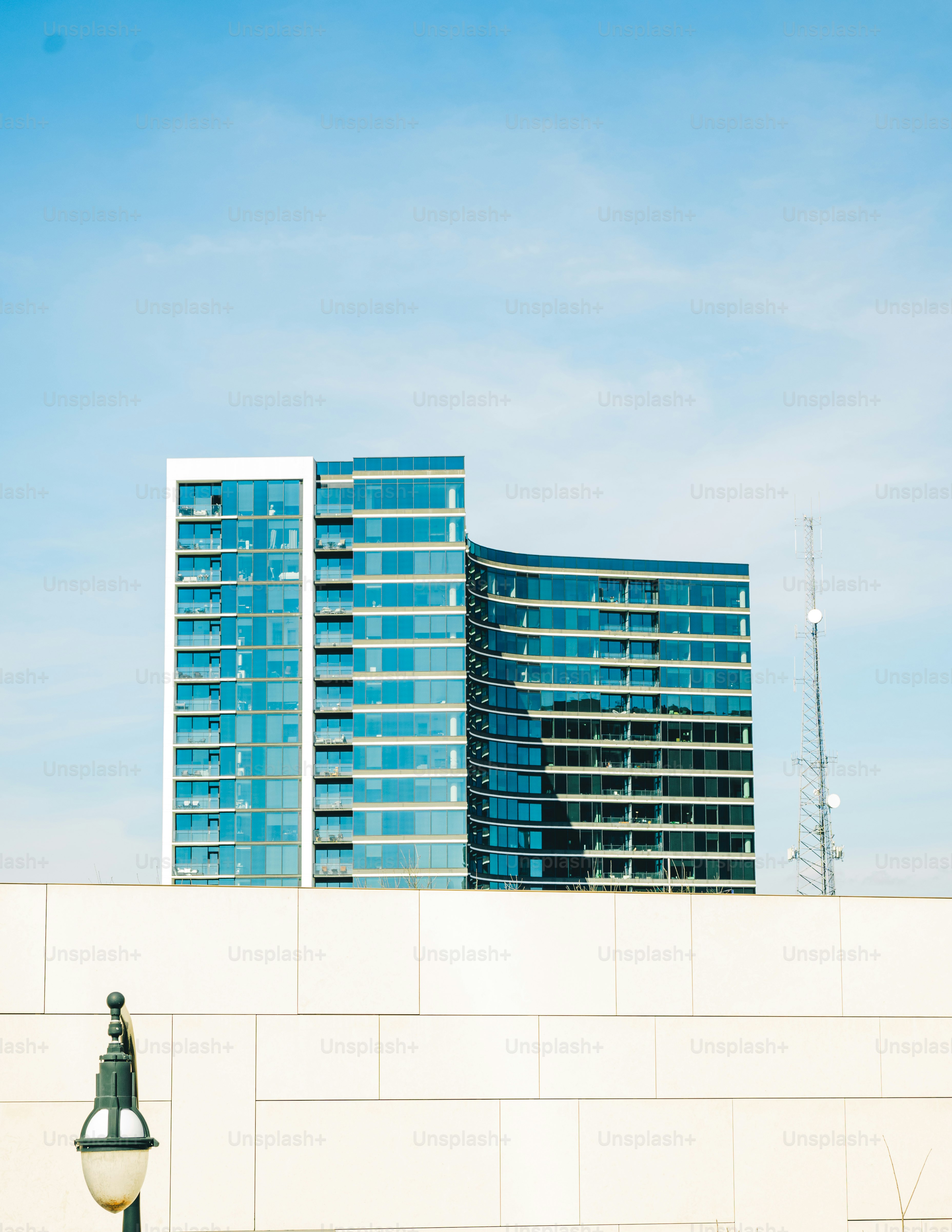 a tall building sitting next to a street light