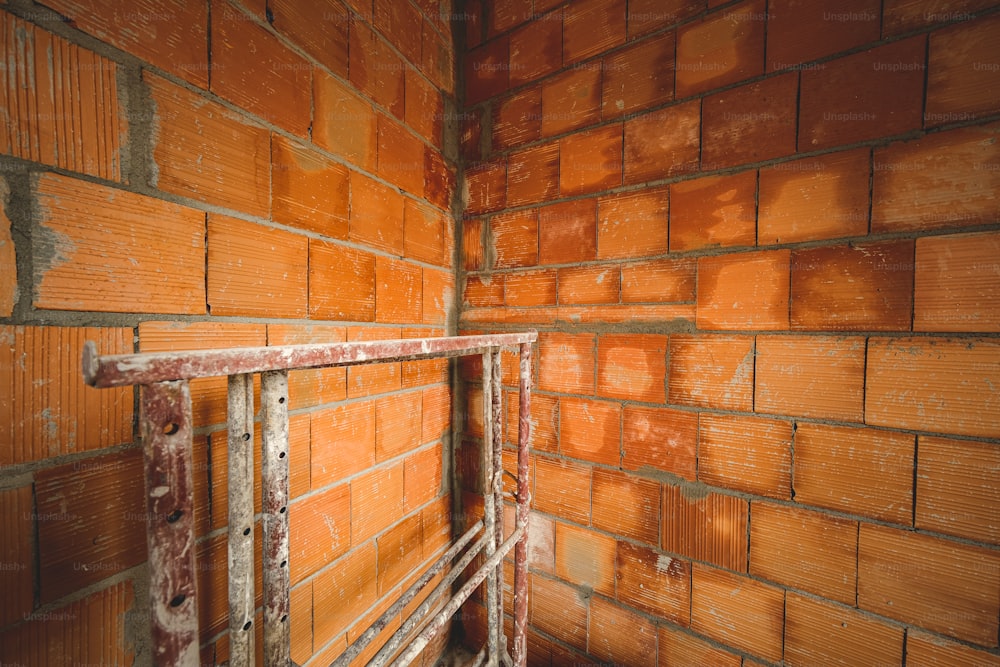 a brick wall with a window in the middle of it