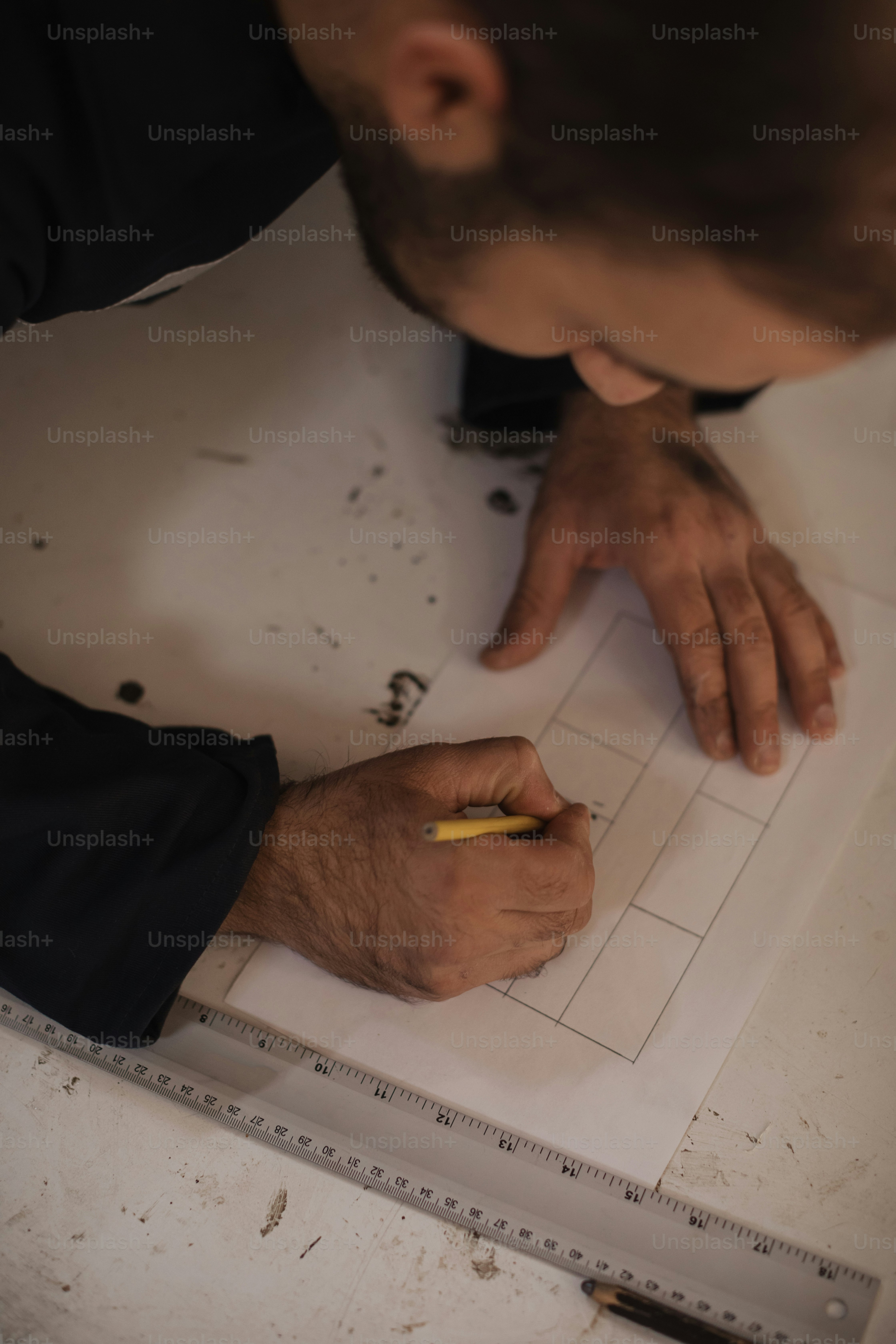 a man is writing on a piece of paper