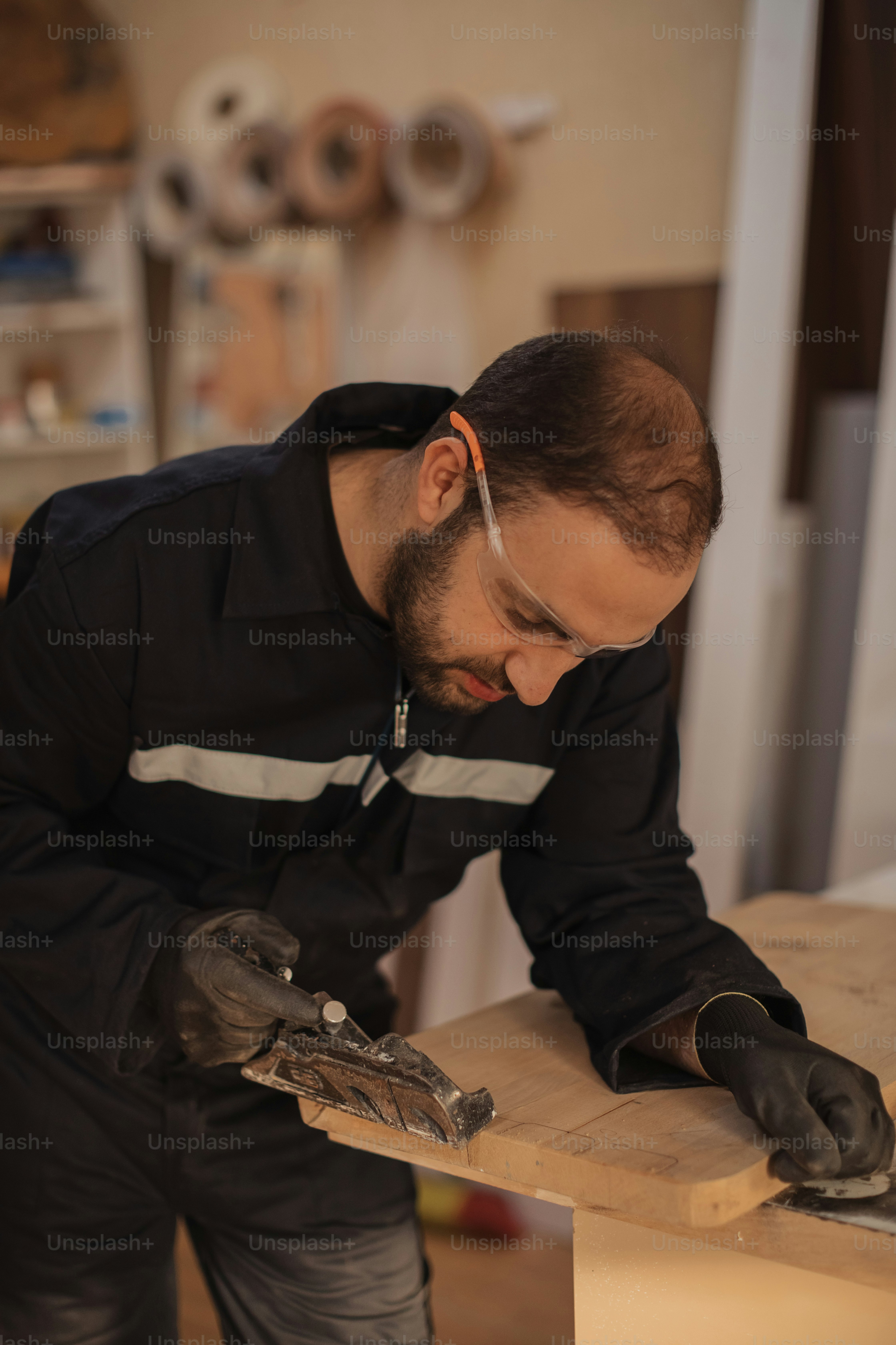a man working on a piece of wood