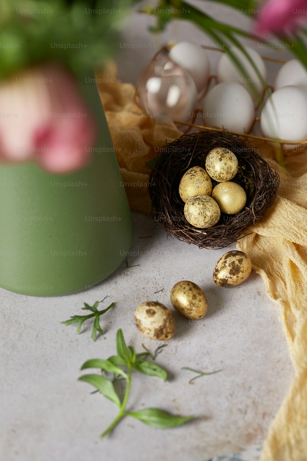 a green vase filled with eggs on top of a table