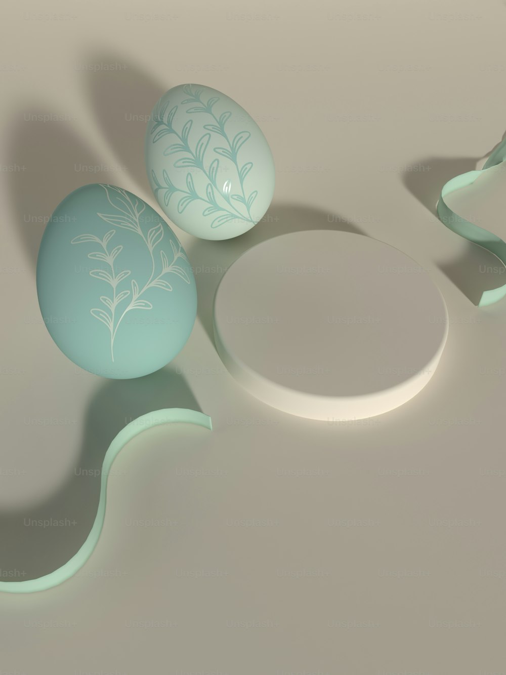 three eggs sitting on top of a white table