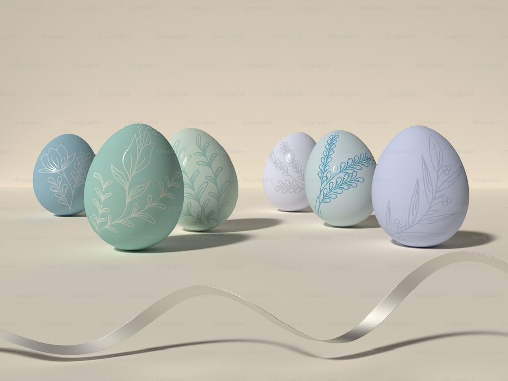 a row of painted eggs sitting on top of a table