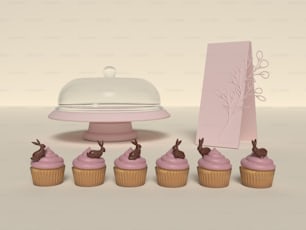 cupcakes y un soporte para pasteles con una tarjeta