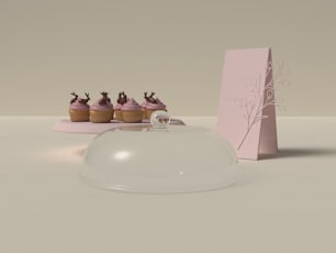 a table topped with cupcakes and a card