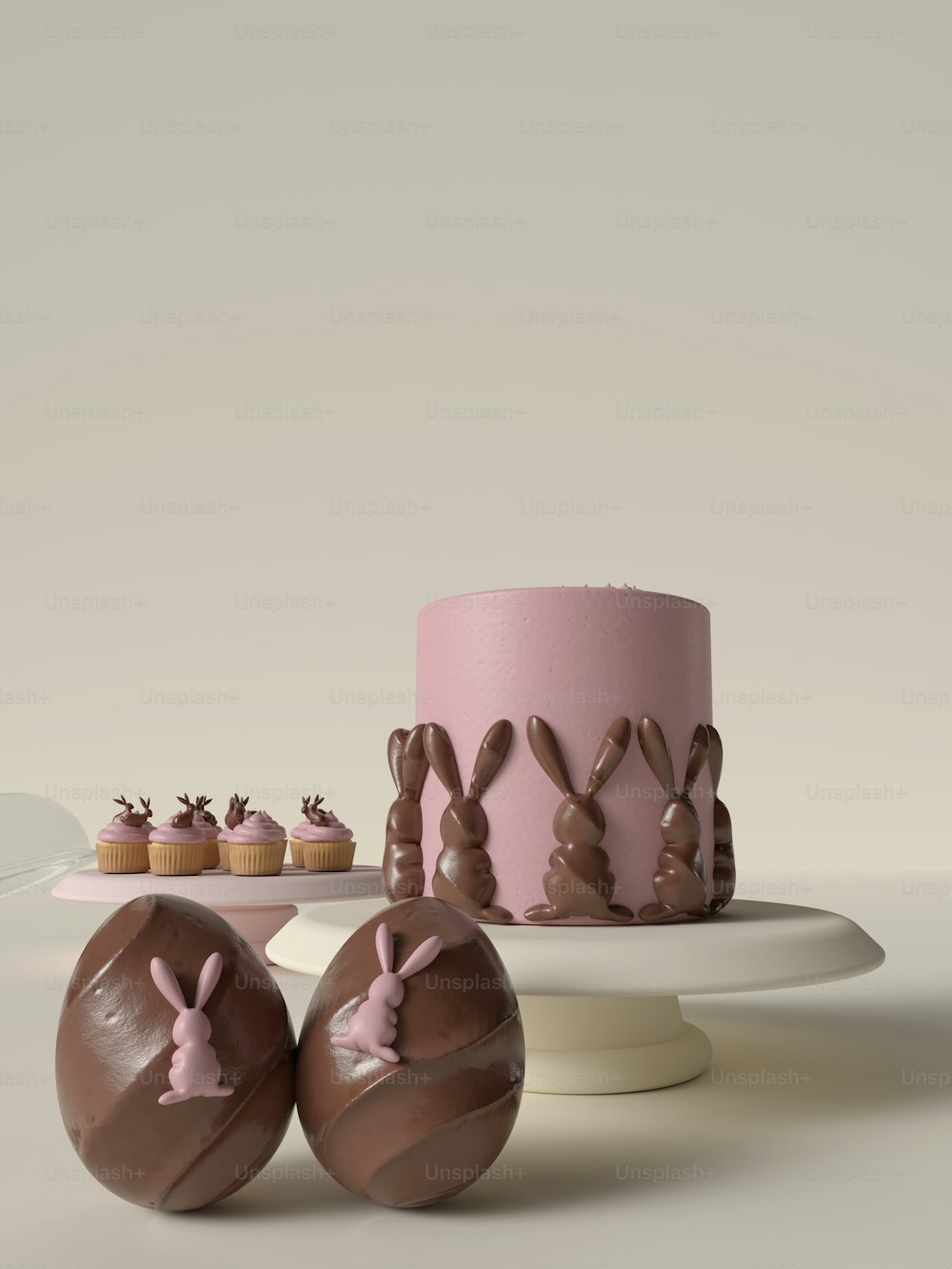 a pink cake with chocolate bunny ears next to it