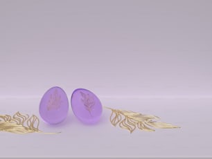 a pair of purple glass earrings with gold leaves