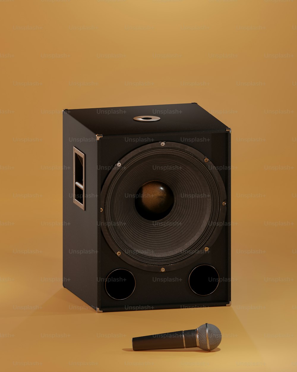 a black speaker with a microphone next to it