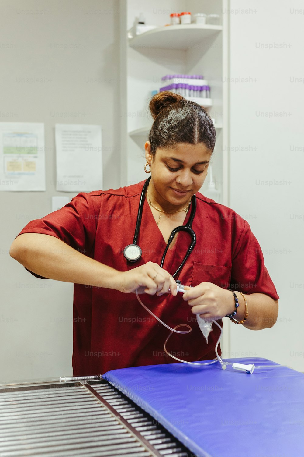 a woman in a red shirt is working on something