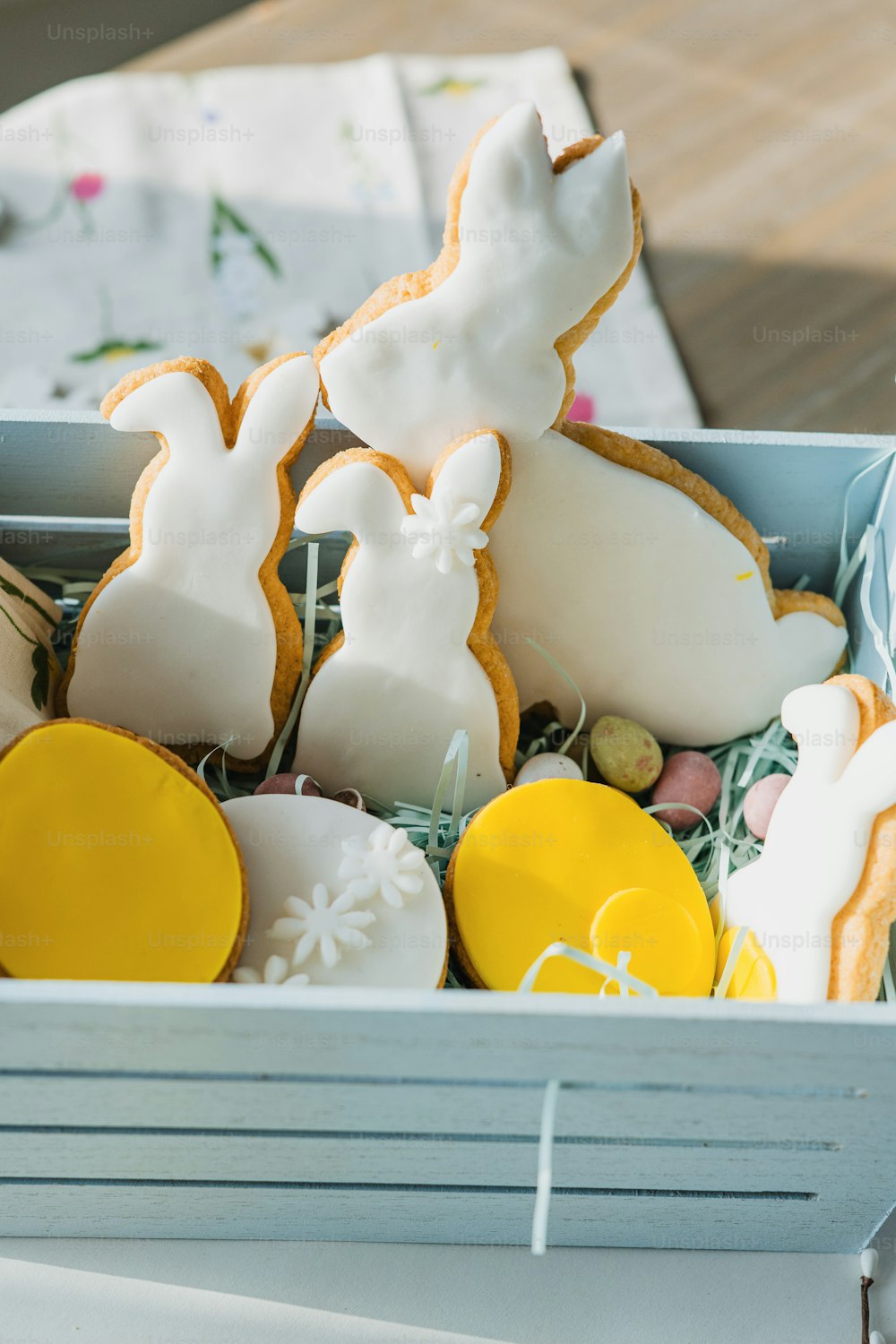 a box filled with cookies and decorated bunnies