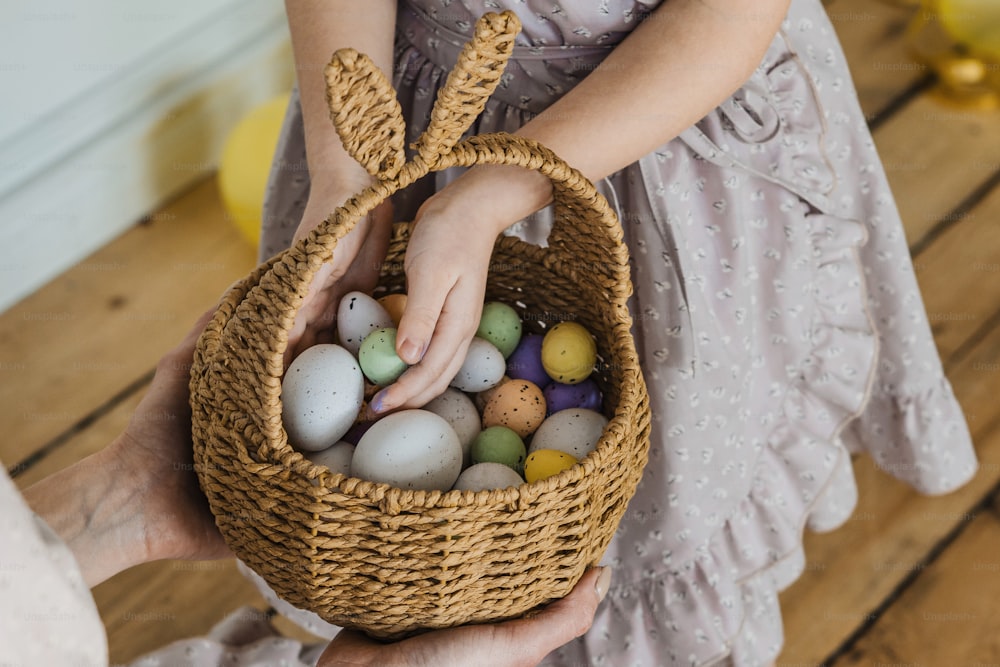 a person holding a basket filled with eggs