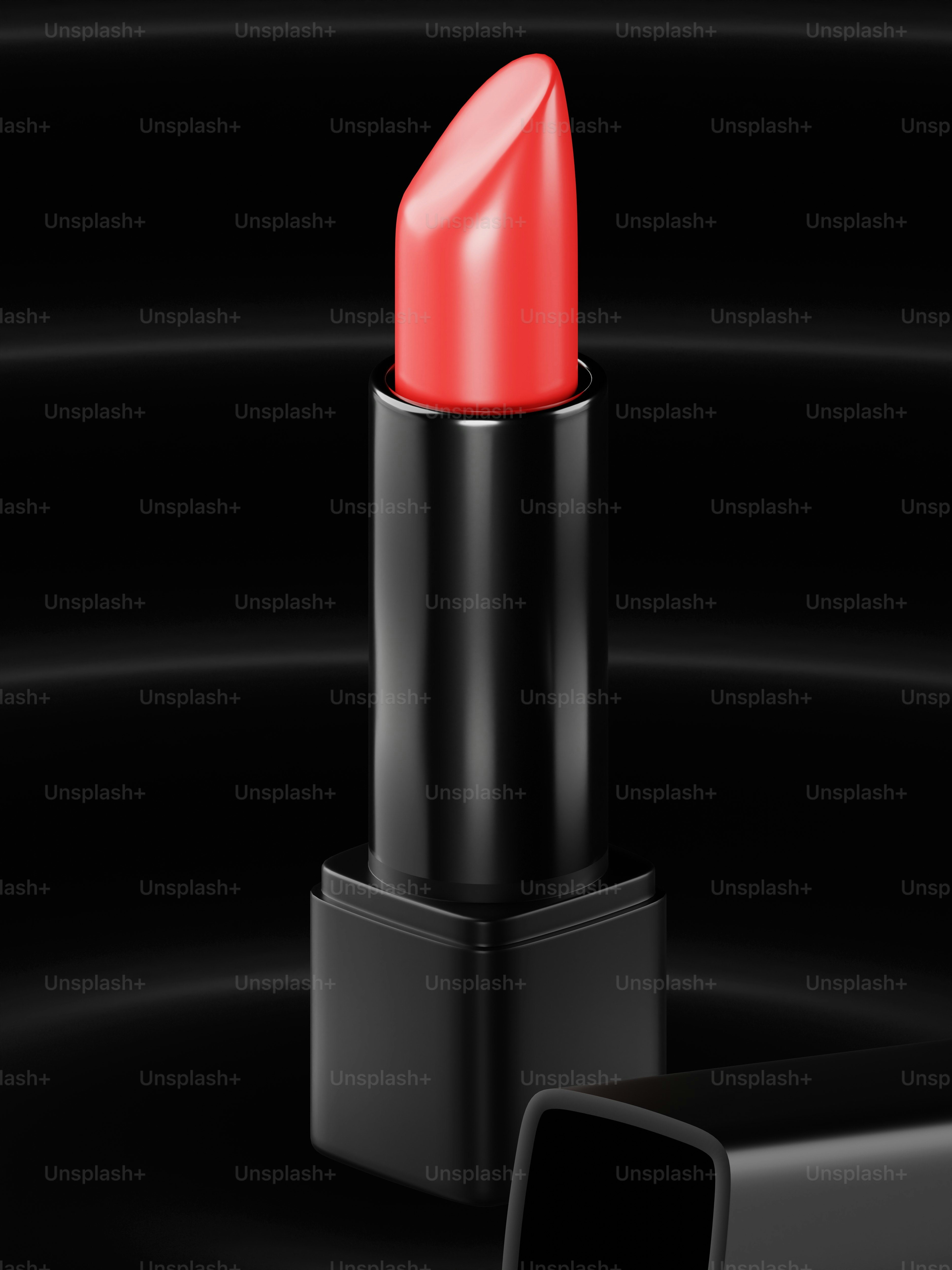 um batom vermelho sentado em cima de uma mesa preta