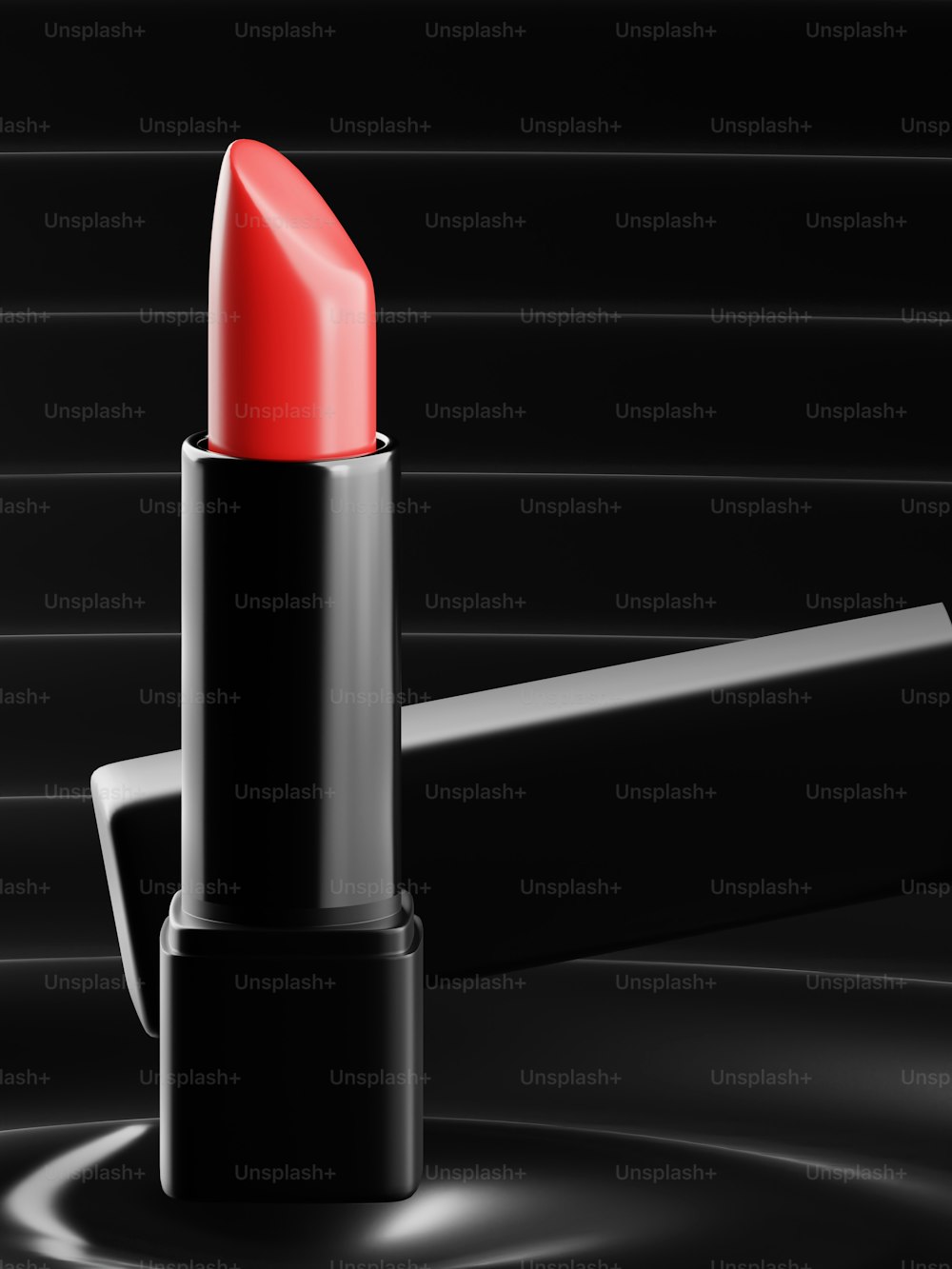 a red lipstick sitting on top of a black table