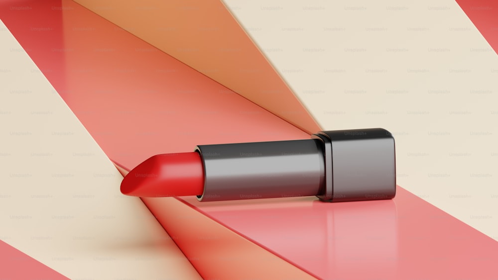 a close up of a red lipstick on a multicolored background
