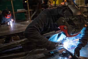 a welder working on a piece of metal