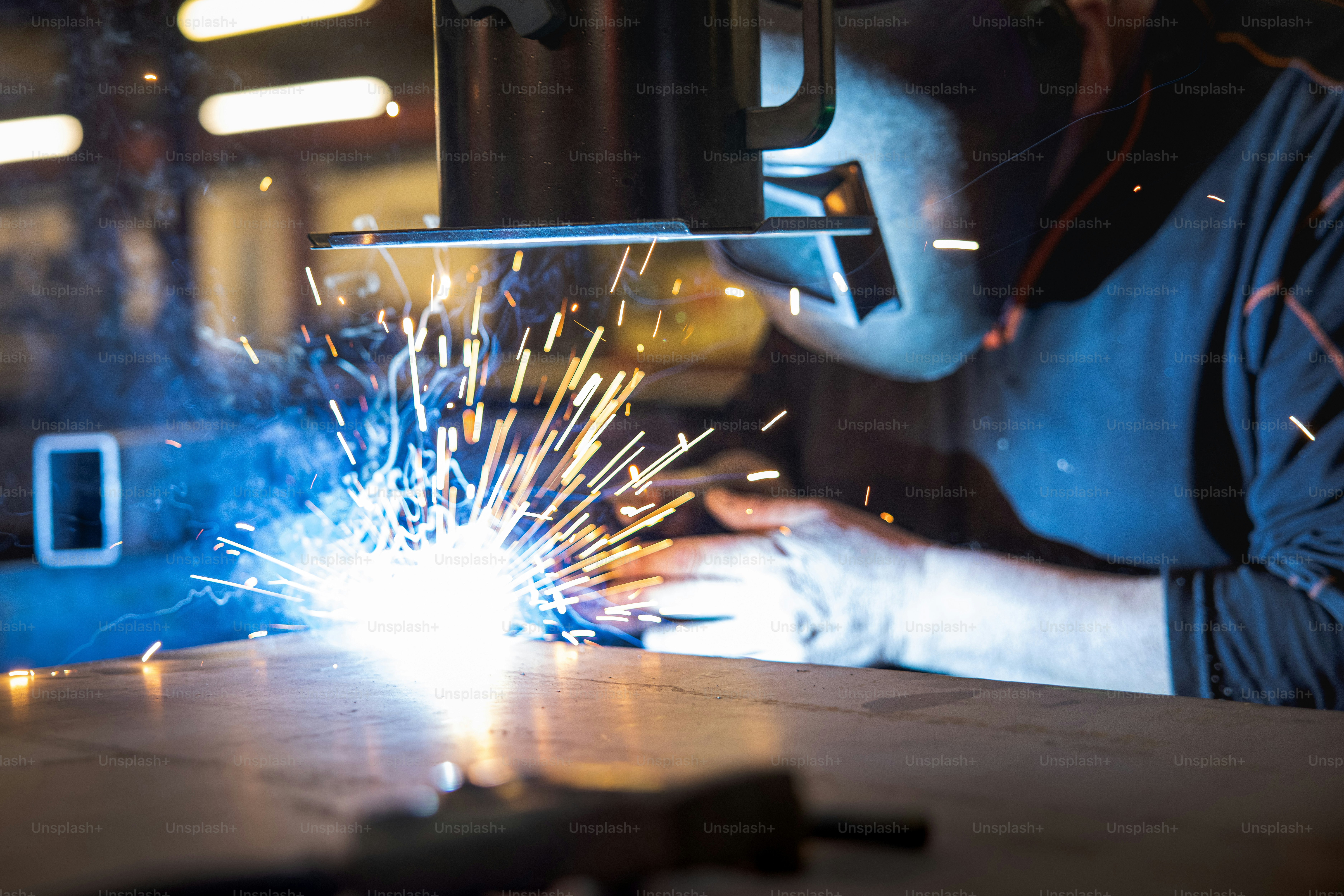 a welder working on a piece of metal
