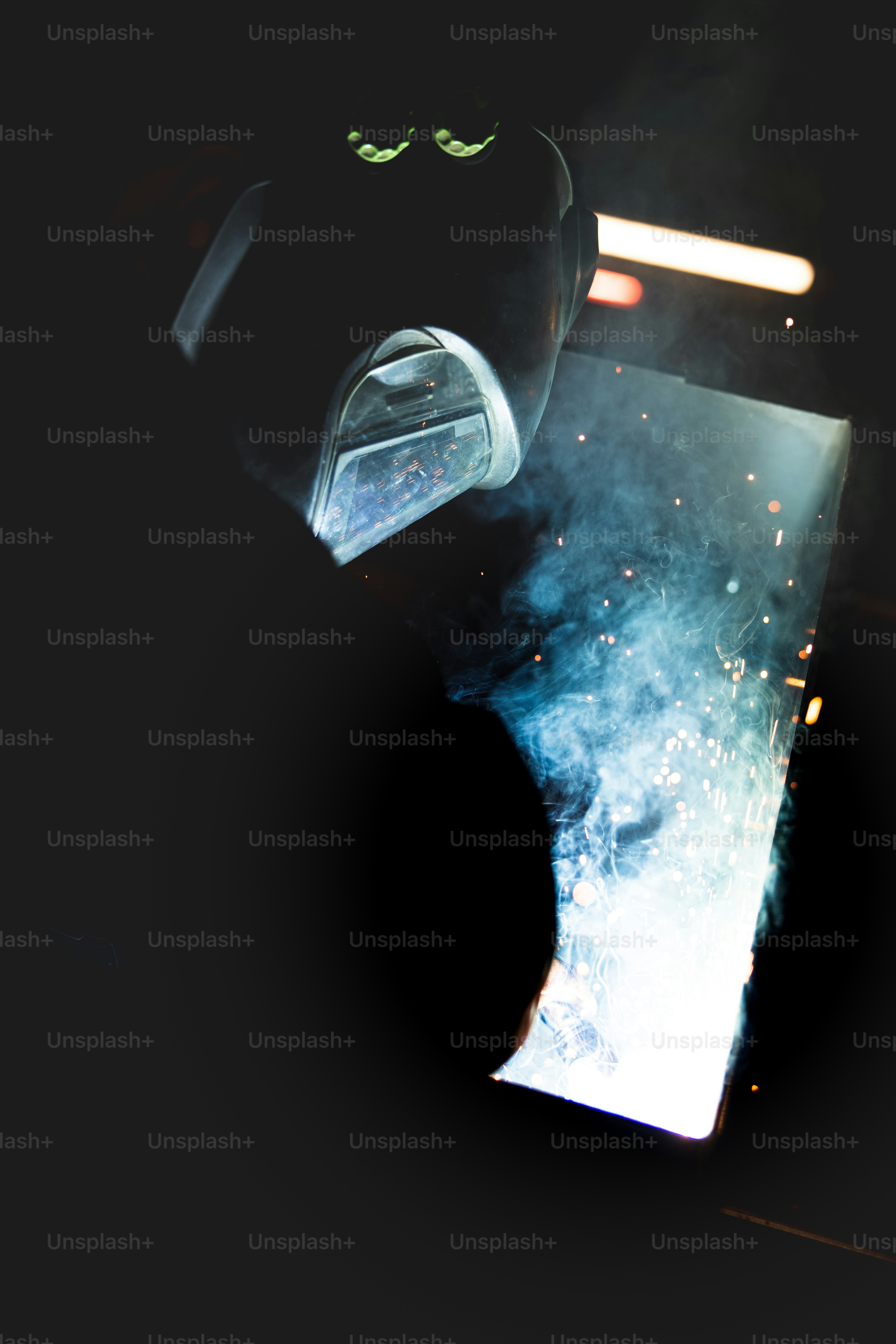 a close up of a piece of metal in the dark